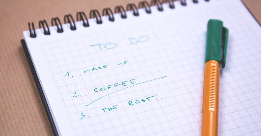 Handwritten to-do list on graph paper notebook with pen. Ideal for organizing tasks.
