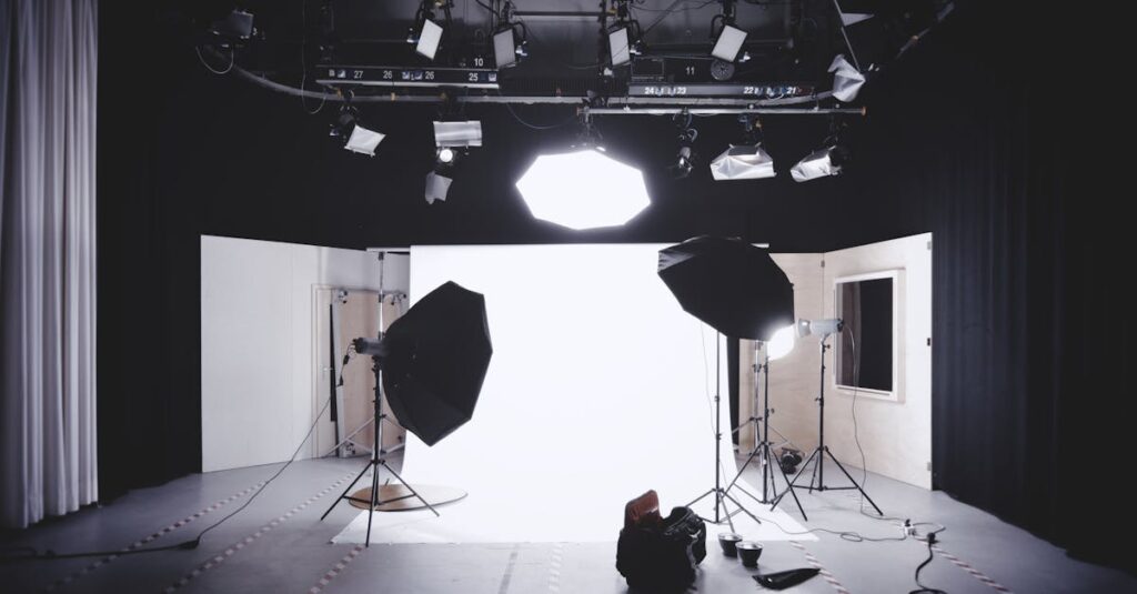 A well-equipped photography studio featuring lights, softboxes, and a white backdrop for professional shoots.